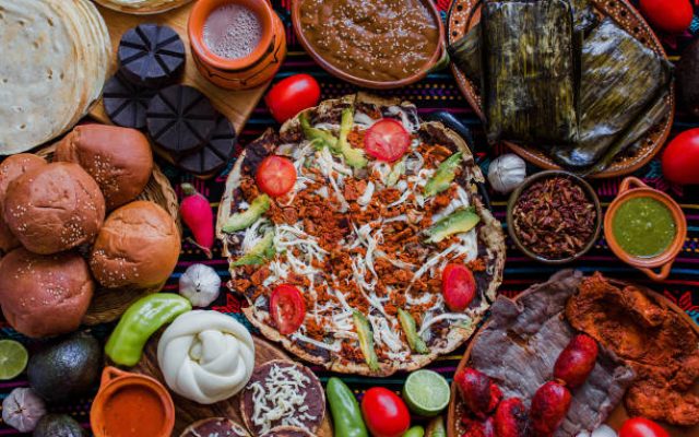 traditional Mexican food from Oaxaca Mexico, Tlayuda, Oaxaca Cheese, tamales and Chocolate.